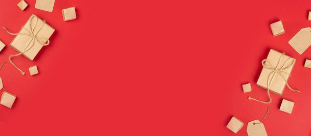 Banner with boxes and labels on a red background. Gift shopping and sale concept - Foto, afbeelding
