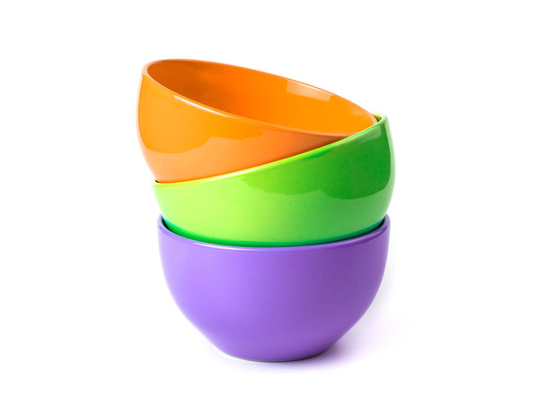 Deep bowls of bright colors on a white background. - Photo, image