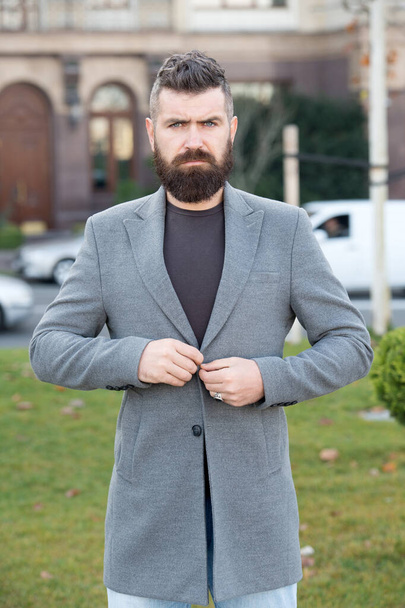 confident male businessman in casual business fashion jacket walk in street having groomed beard and hairstyle, confidence and charisma - Zdjęcie, obraz
