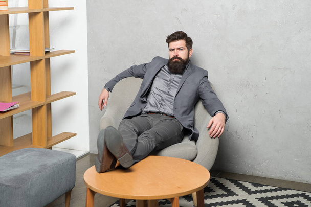 Tired businessman. Brutal businessman relaxing at workplace. Bearded businessman having break for rest in office. Businessman with beard and mustache in formalwear - Valokuva, kuva