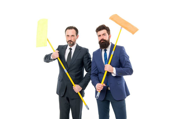 Cover our tracks before someone find out financial fraud. Clear reputation. Bearded men formal suits hold mops. Big cleaning day. Cleaning business. Household duties. Cleaning service concept - Zdjęcie, obraz