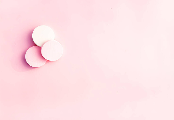 Cosmetic sponges in pastel colors on soft pink background. - Photo, image