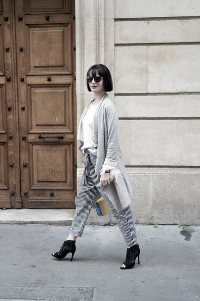 parisian fashion model walk outdoor in street. - Photo, Image