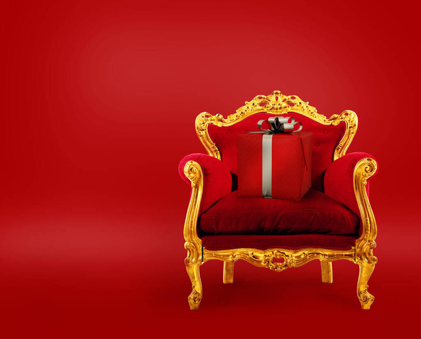 Pohodlné červené a zlaté křeslo s vánočním dárkem. Koncept jako premier doručení služby - Fotografie, Obrázek