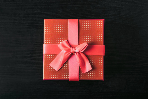 Gift boxes over dark wooden background - Foto, Imagen