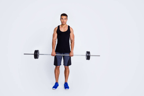 Full length body size view of his he nice attractive content sportive serious guy doing exercise lifting barbell body sculpt pilates progress isolated over light gray pastel color background - Fotoğraf, Görsel