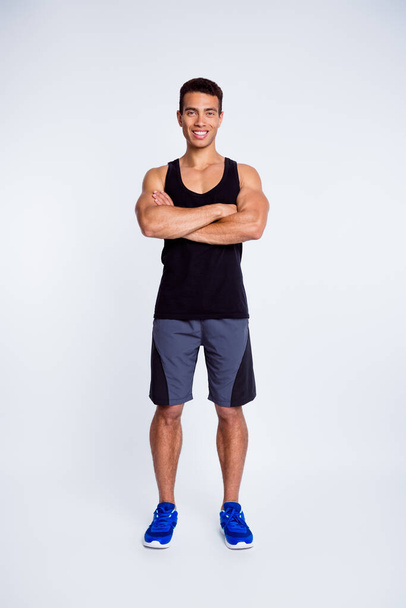 Vertical full length body size view of his he nice attractive strong tall sportive cheerful cheery muscular guy folded arms isolated over light gray pastel color background - Fotografie, Obrázek