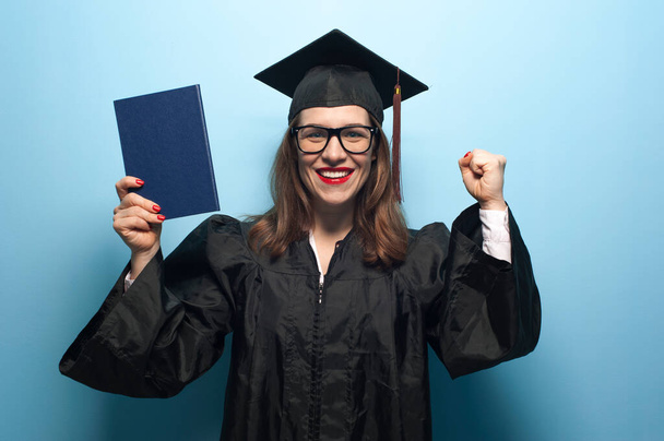Happy smiling graduate female student with diploma - Zdjęcie, obraz