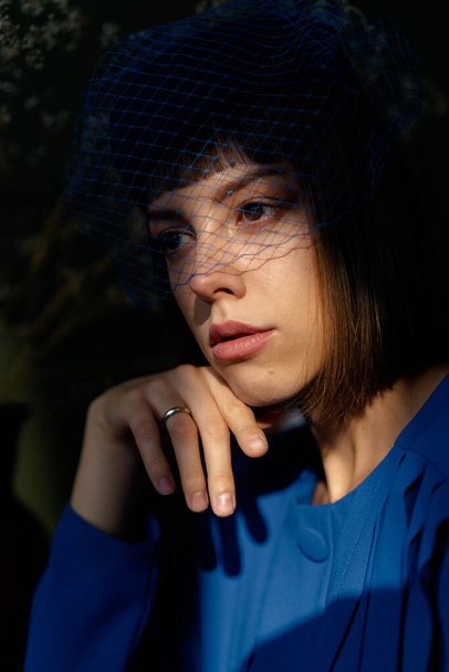 portrait of young woman in blue headdress with veil  - Fotó, kép