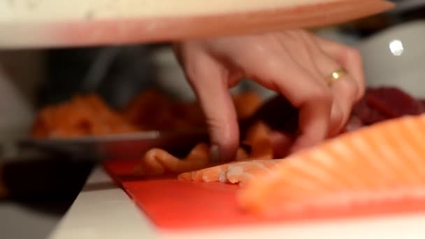 Cutting slices of fish for sushi - Footage, Video
