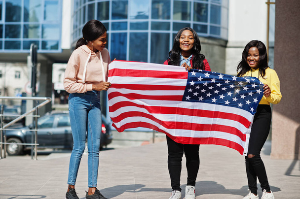 Three young college african american womans friends with flag of USA. - Photo, Image