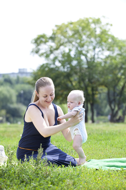 Mother and her little son outdoors session  - 写真・画像