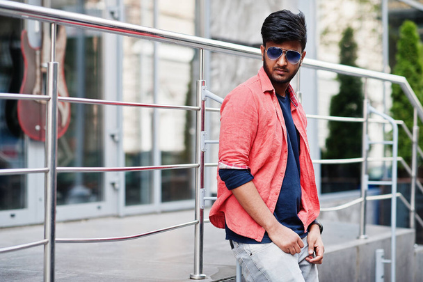 Portrait of young stylish indian man model pose in street in sunglasses. - Foto, imagen