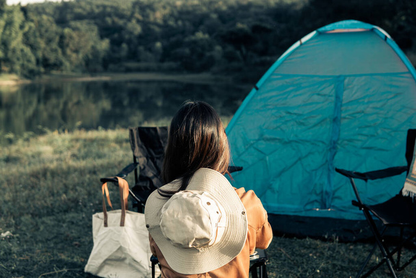Hipster woman resting and relaxing with her camping set on the holiday and slow life. - Photo, image