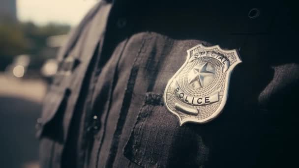 Cropped view of special police lettering on badge of policeman  - Footage, Video