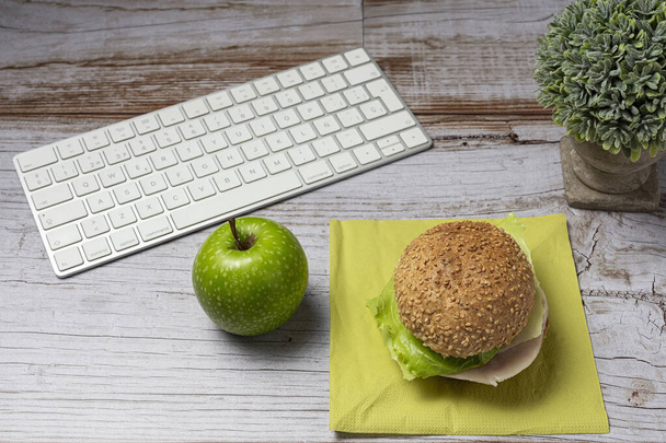 Lunch at work place healthy sandwich near laptop on work table. Home food for office concept - Fotografie, Obrázek