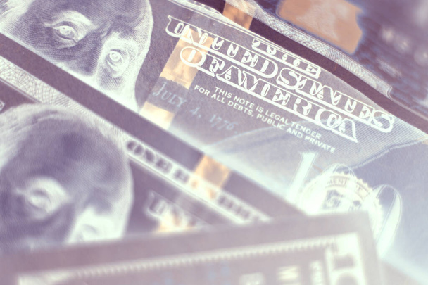 Close up Franklin's face on a one hundred dollar. American, US Dollars Cash Money in negative. Background pattern for design.	 - 写真・画像