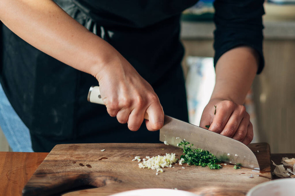 Close up shot of a chef chopping parsley - Фото, зображення