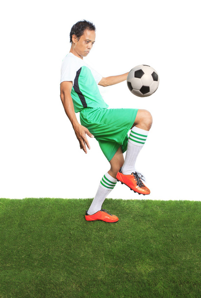 portrait of football ,soccer players playing soccer ball on gree - 写真・画像