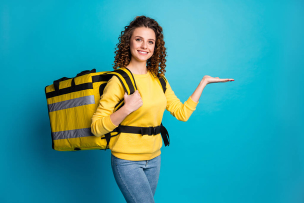 Portrait of her she nice attractive cheerful confident wavy-haired girl carrying takeout meal holding copy space on palm isolated over bright vivid shine vibrant blue color background - Photo, Image