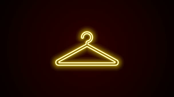Gloeiende neon lijn Hanger garderobe pictogram geïsoleerd op zwarte achtergrond. Cloakroom icoon. Kleding service symbool. Wasserij hangerbord. 4K Video motion grafische animatie - Video