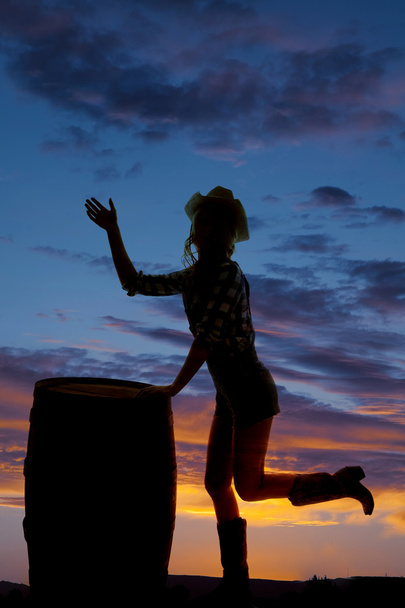 silhouette cowgirl by barrel wave - Zdjęcie, obraz