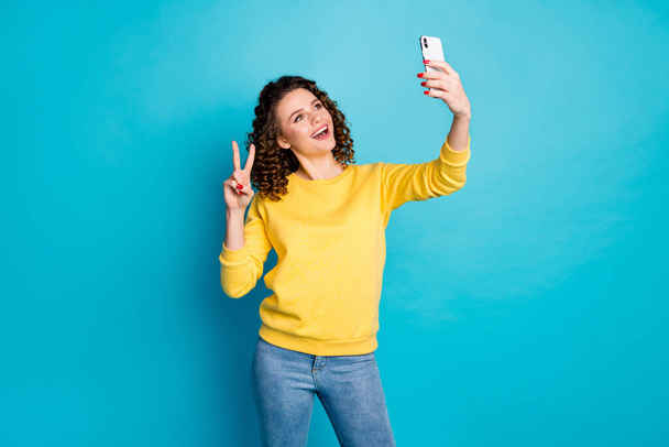 Portrait of her she nice attractive pretty lovely friendly cheerful cheery wavy-haired girl taking selfie showing v-sign isolated over bright vivid shine vibrant blue color background - Fotoğraf, Görsel