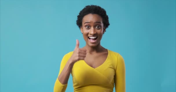 Happy woman giving thumbs up gesture - Footage, Video
