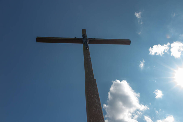 Wooden cross against a blue sky - Photo, Image
