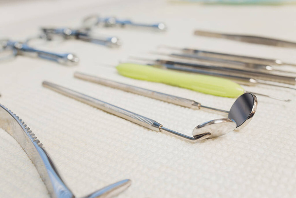 Set of metallic dentist tools. Dentist choses metal head for dentist s drill. Dentist clinic. - Foto, imagen
