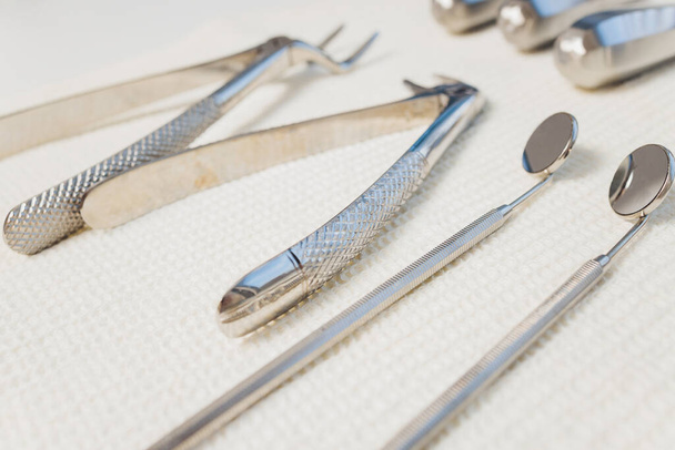 Set of metallic dentist tools. Dentist choses metal head for dentist s drill. Dentist clinic. - Valokuva, kuva
