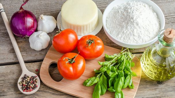Ingredients for pizza on the wooden background - Photo, Image