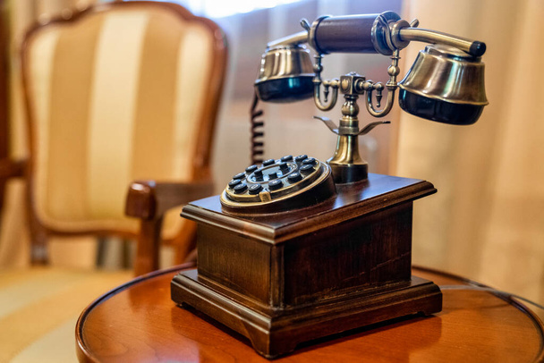 Vintage old telephone with binoculars conceptual still life - Fotó, kép