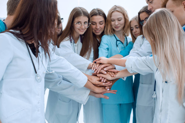top view. a group of smiling doctors pointing at you. - Foto, afbeelding