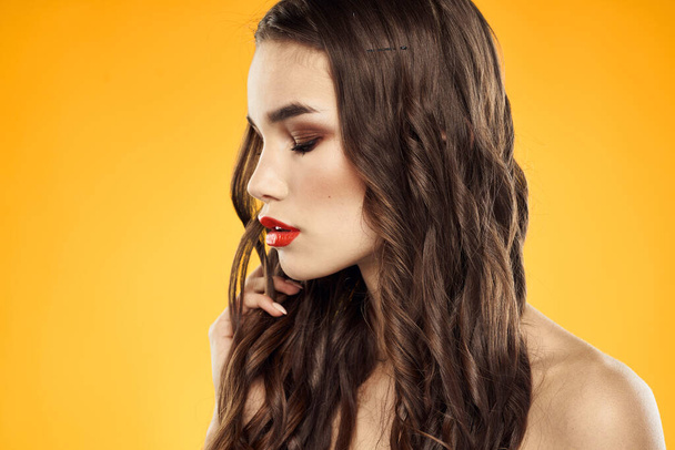 Woman with bare shoulders red cropped lips charm yellow background - Fotografie, Obrázek