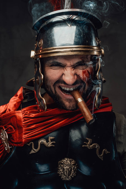 Mad imperial soldier from rome smoking cigar - Photo, Image