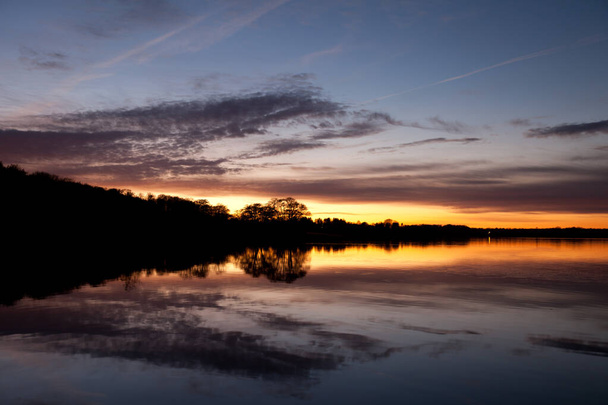 Sunset in Sjaelsoe lake in Rudersdal in Denmark - Photo, image