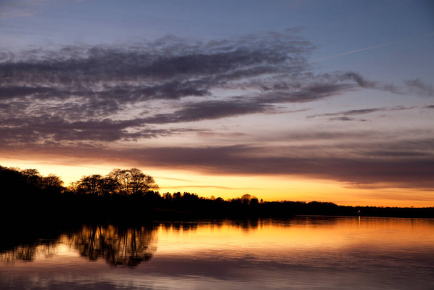 Sunset in Sjaelsoe lake in Rudersdal in Denmark - Photo, image