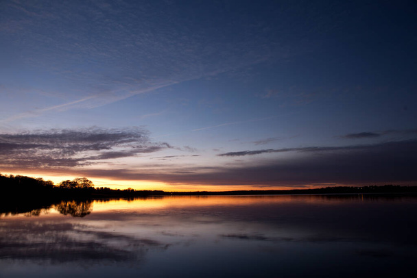 Sunset in Sjaelsoe lake in Rudersdal in Denmark - Foto, Imagem