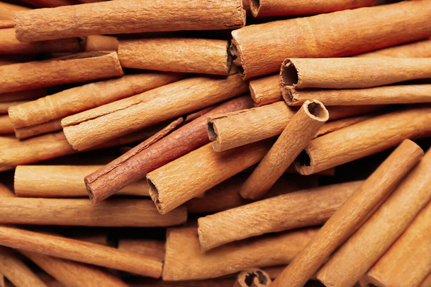 Many cinnamon sticks as background - Photo, Image
