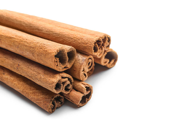 Cinnamon sticks on white background, closeup - Photo, Image
