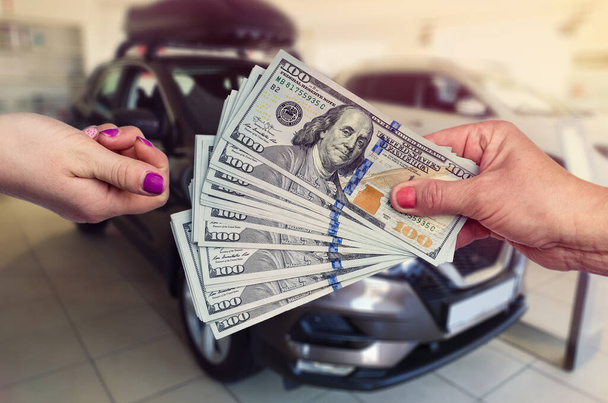 customer giving us money seller for sale or rent new car . - Photo, Image