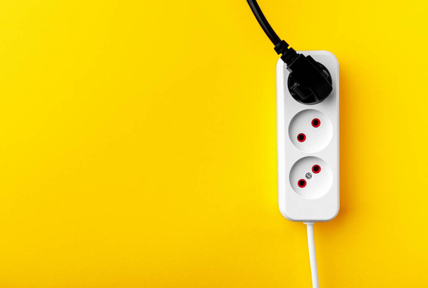 electric socket isolated on a yellow background - Photo, Image