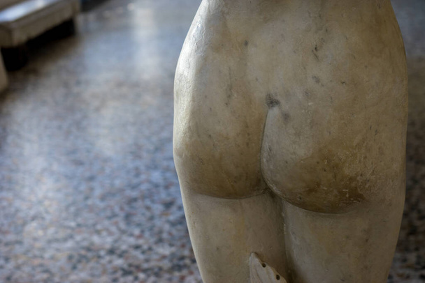 Italy, Bellagio, sculpture detail of classic male female form, focus on derriere / posterior / ass - Photo, Image
