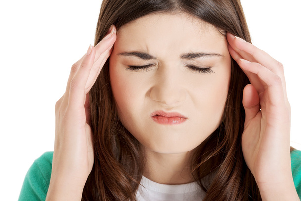 Teen woman with headache - Фото, изображение
