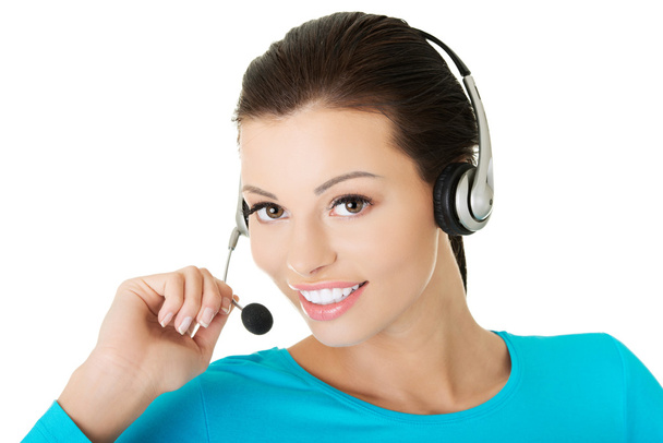 Call center assistant smiling - Foto, afbeelding