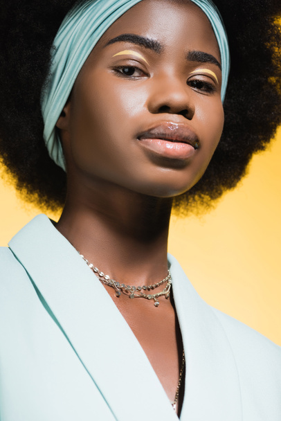african american young woman in blue stylish outfit isolated on yellow  - Foto, Imagem