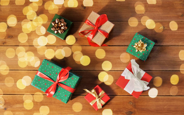 christmas gifts on wooden boards - 写真・画像
