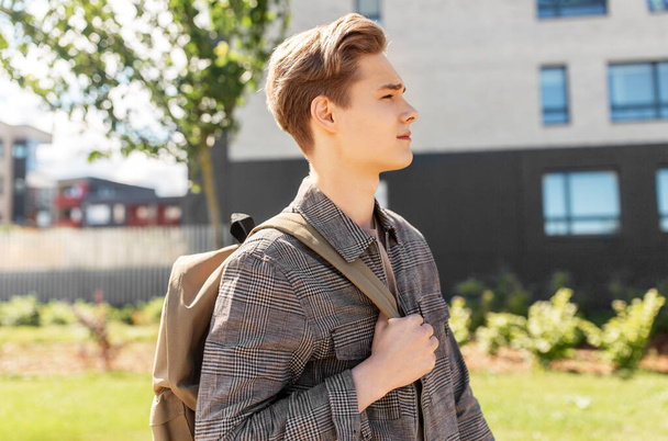 teenage student boy with backpack in city - Fotó, kép