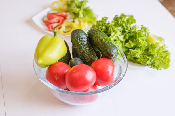 fresh vegetables in a glass jar on a white background - Zdjęcie, obraz